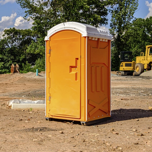 what is the cost difference between standard and deluxe portable restroom rentals in Monetta